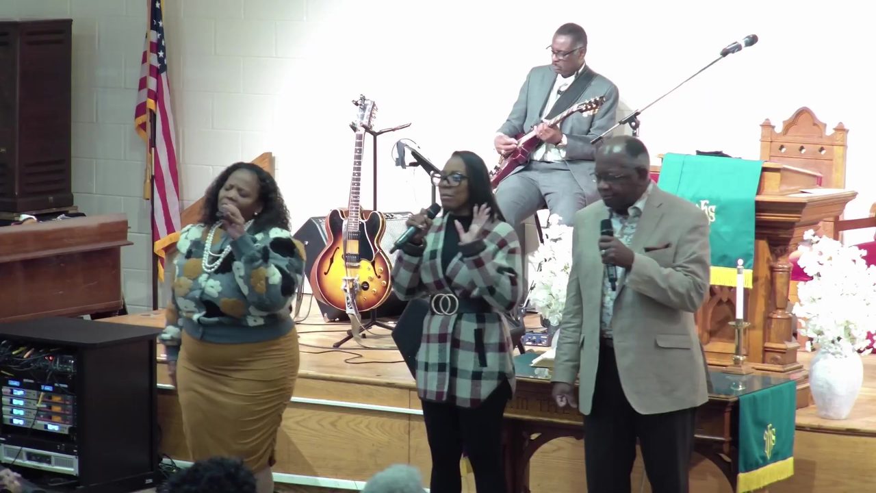 A vocalist leads praise during Sunday worship